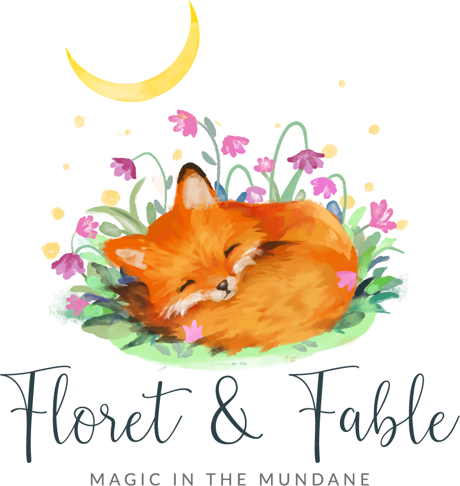 A fox curled on a bed of flowers under a crescent moon